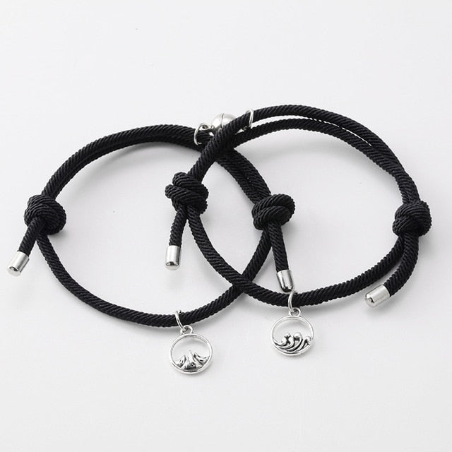 Roter und schwarzer Seilnetzmagnet, der Paararmband anzieht